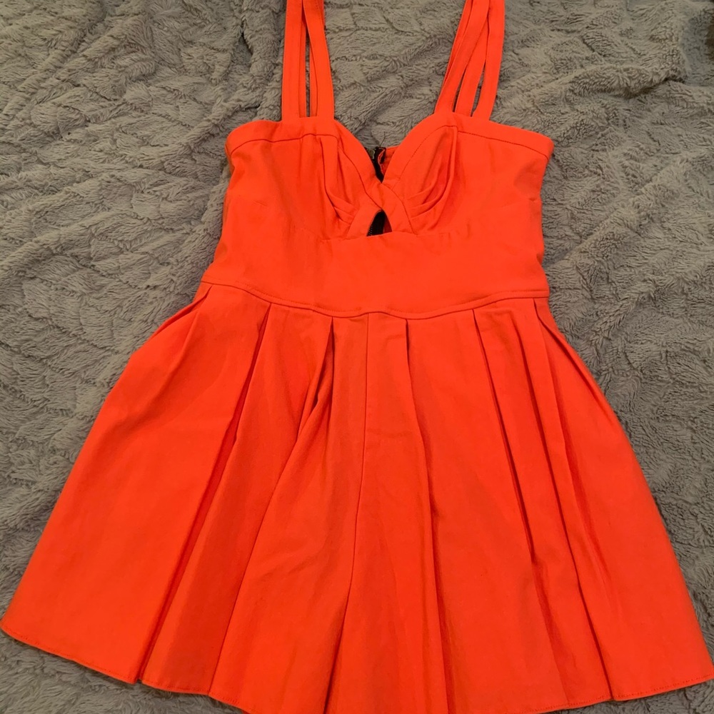 Red/orange romper dress.